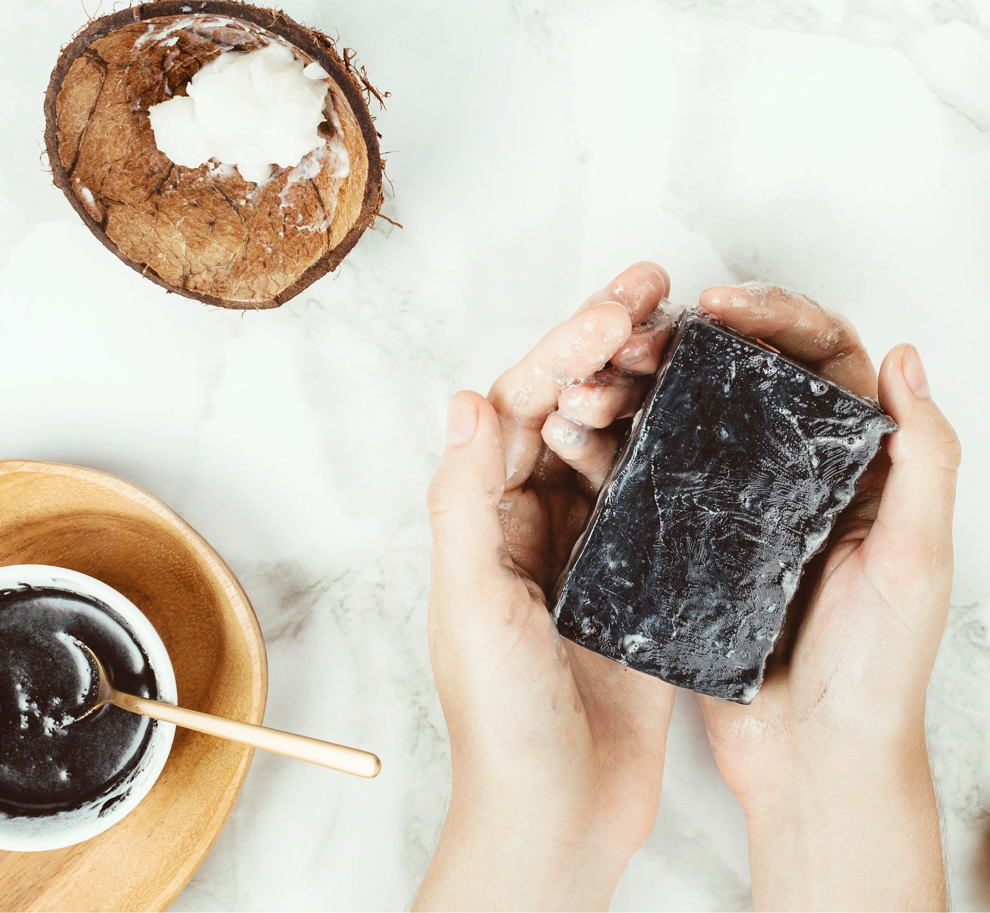 Face & Body Soap Bar with the aromas and skin-soothing benefits of essential oils being used in the shower to clean and revitalize.