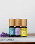Prime Potion Pure Essential Oil Set of 3: peppermint, lavender, and lemon in 10 mL vials with bamboo wood tops.