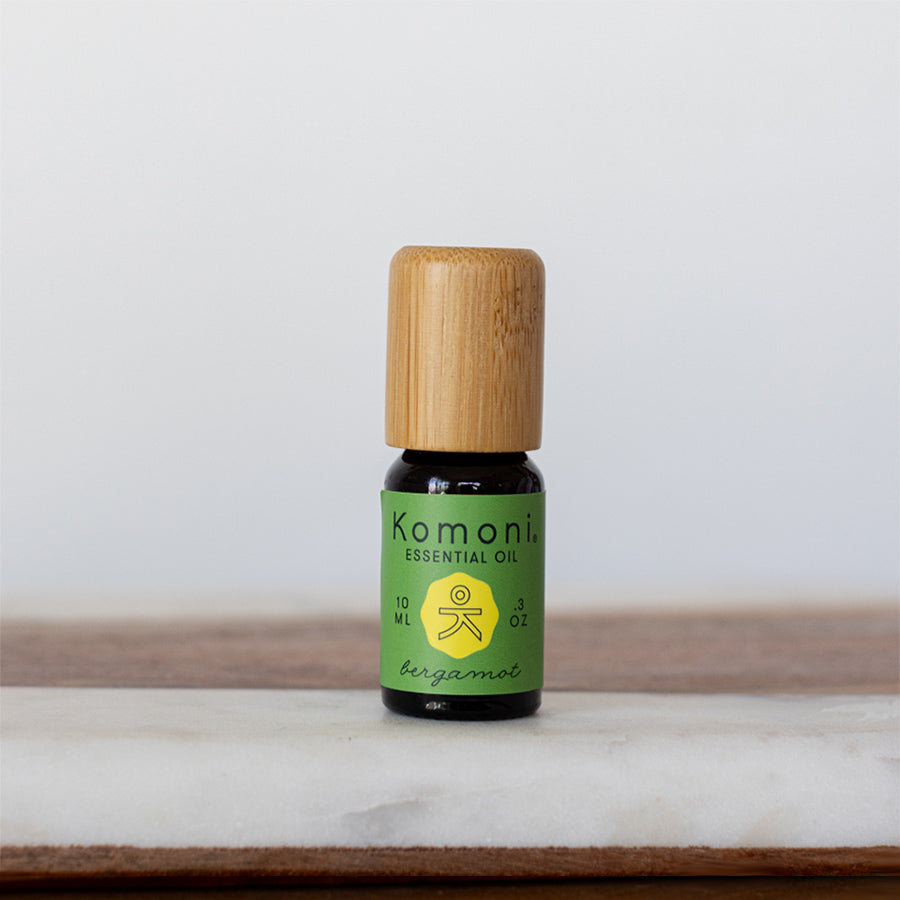 Bergamot pure essential oil in 10 mL bottle with bamboo wood top.