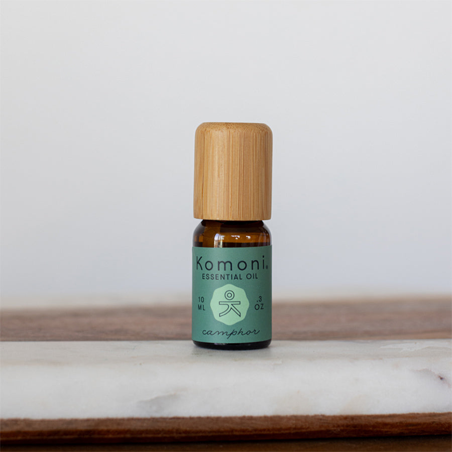 Camphor pure essential oil in 10 mL bottle with bamboo wood top.