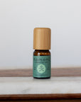 Camphor pure essential oil in 10 mL bottle with bamboo wood top.