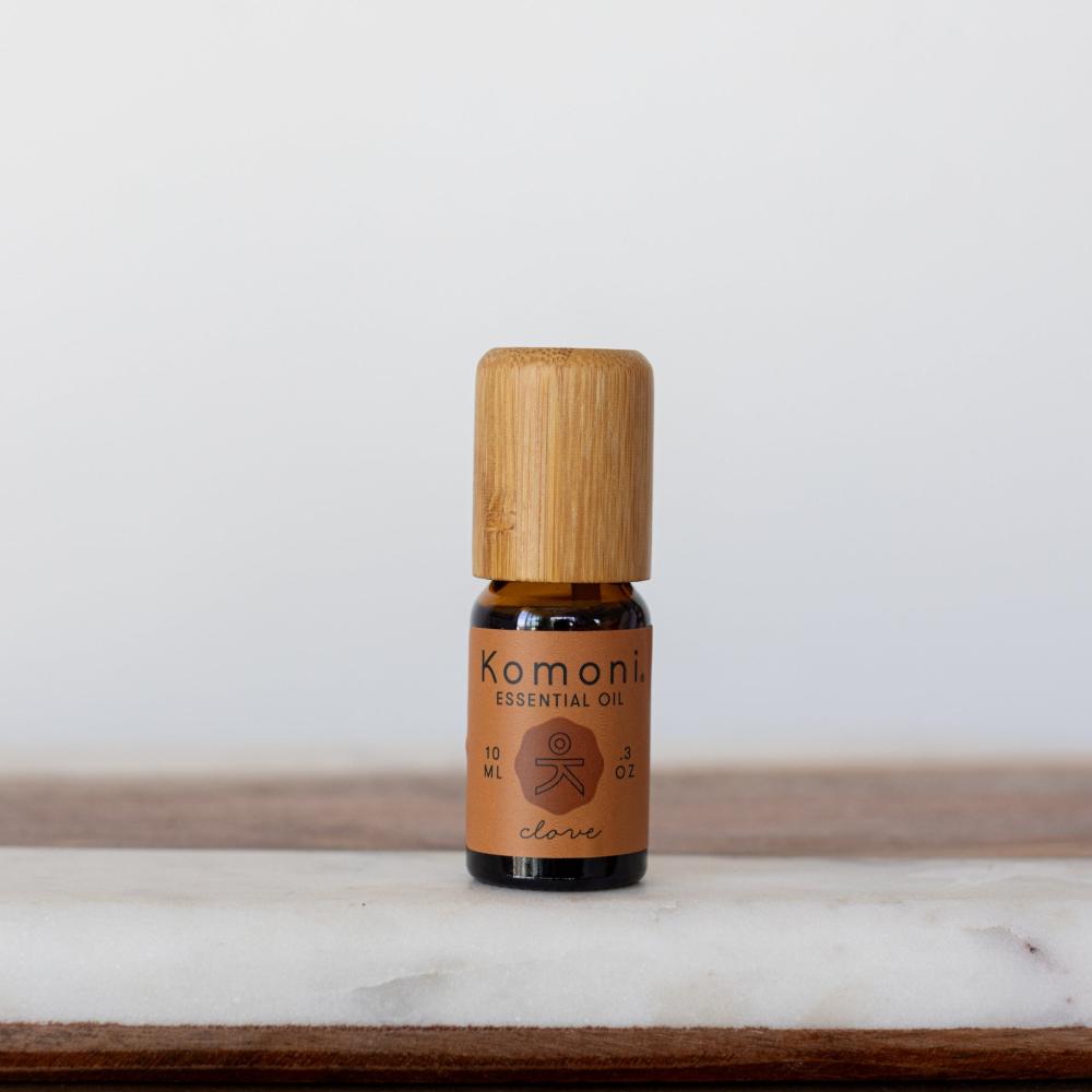 A 10ml vial of Clove pure essential oil with attractive bamboo wood top offers a sweet, spicy solution brings purpose and direction for aromatherapy, cosmetics, and even homemade cooking.