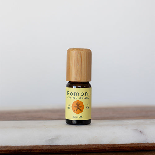 Detox proprietary blend of pure essential oils in 10 mL bottle with bamboo wood top.