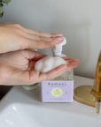 Hands dispense a foam of the Lavender Everything soap for your kitchen or bathroom sink. Plant-based soap blends soothing essential oils with gentle botanicals to provide an all-natural clean. Ideal for hands, dishes, and countertops.