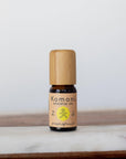 A 10ml vial of Grapefruit pure essential oil with attractive bamboo wood top offers an uplifting, natural remedy known for its fresh, sweet-tangy scent that promotes happiness and well-being while supporting skin health.