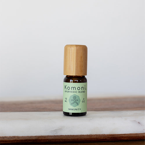 IMMUNITY proprietary blend of pure essential oils in 10 mL bottle with bamboo wood top.