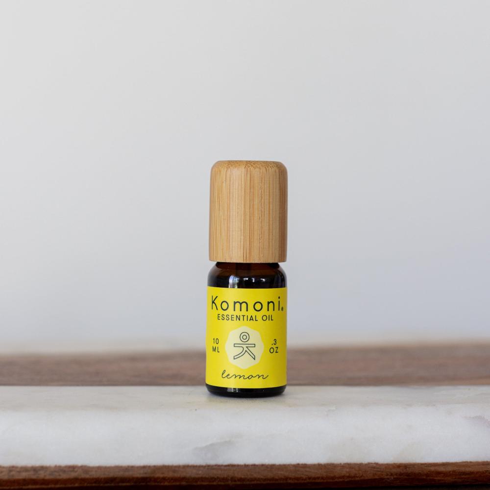 A 10ml vial of Lemon pure essential oil with attractive bamboo wood top offers a bright, uplifting scent that promotes happiness and well-being. Supports oily skin and a healthy complexion.