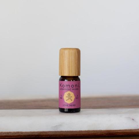 A 10ml vial of Love-Herb pure essential oil blend with attractive bamboo wood top offers a blend of lavender and grapefruit for a warm, balanced, intimate atmosphere. 