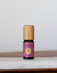 A 10ml vial of Love-Herb pure essential oil blend with attractive bamboo wood top offers a blend of lavender and grapefruit for a warm, balanced, intimate atmosphere. 