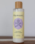 8 oz. pastel yellow bottle of Nourish lavender essential oil conditioner for all hair types.