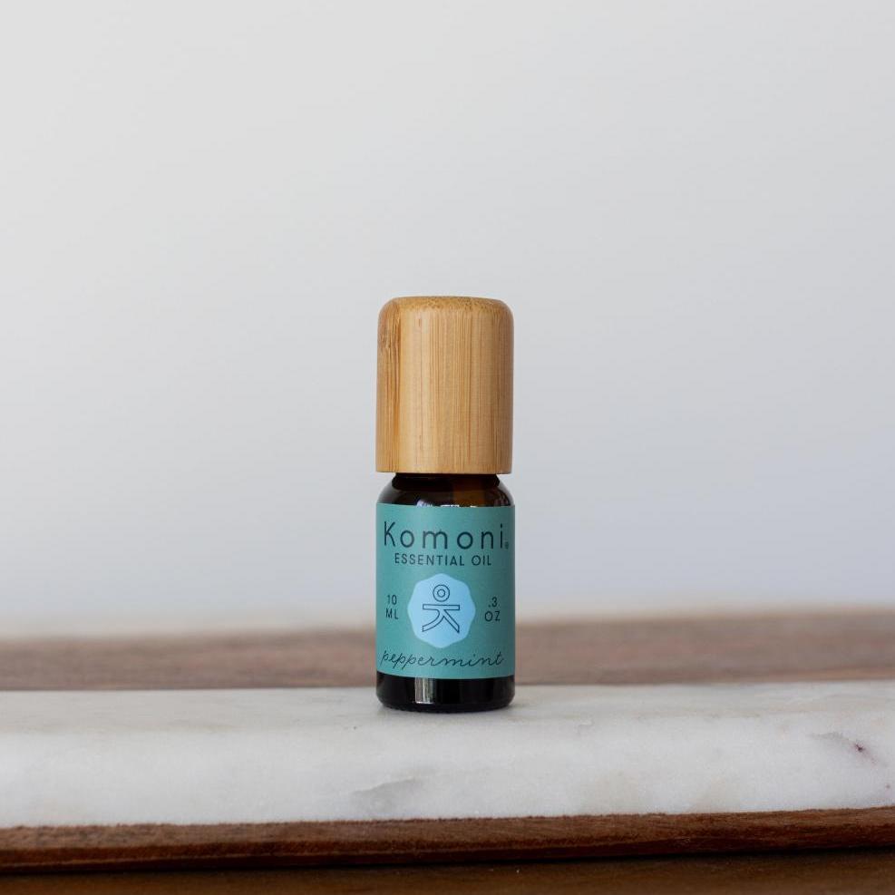 A 10 mL vial of Peppermint Essential Oil with attractive bamboo wood top offers a natural, uplifting, crisp, cool aroma that instantly invigorates the senses, helping to ease tension and improve concentration.