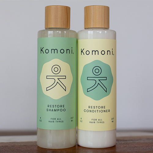 Two 8 oz. bottles of Restore rosemary-mint essential oil Shampoo & Conditioner.