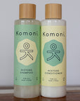 Two 8 oz. bottles of Restore rosemary-mint essential oil Shampoo & Conditioner.