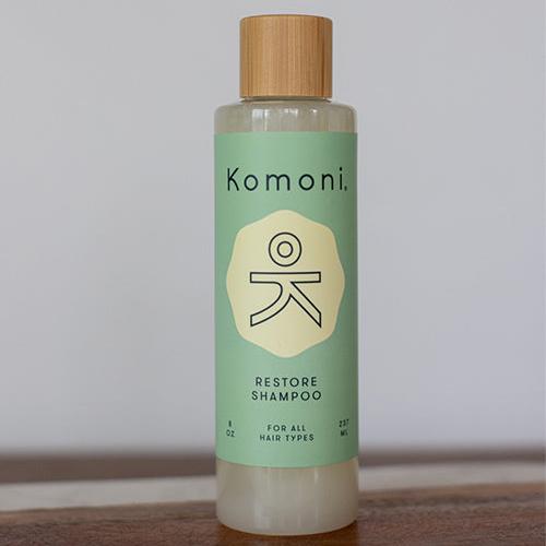 8 oz. pastel green bottle of Restore Rosemary-Mint-Sage botanical essential oil shampoo for all hair types.