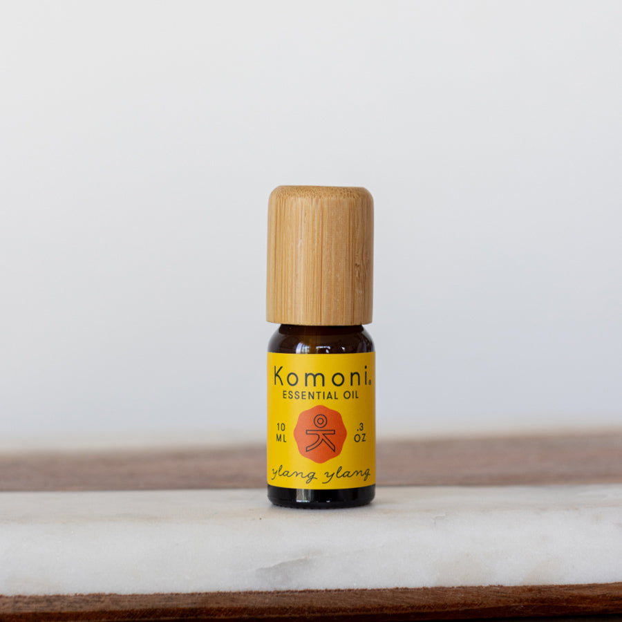 Ylang-Ylang pure essential oil in 10 mL bottle with bamboo wood top.