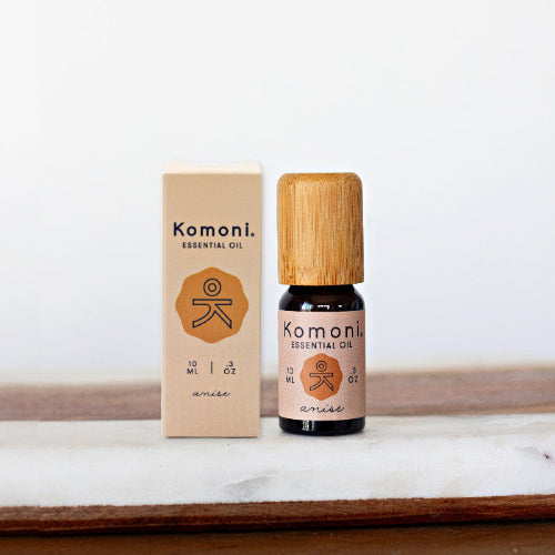 A 10ml vial of Anise Pure Essential Oil with attractive bamboo wood top next to its box packaging.