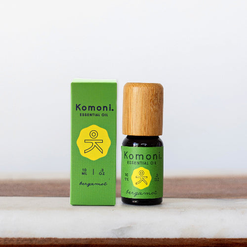 Bergamot pure essential oil in 10 mL bottle with bamboo wood top - shown next to retail box.