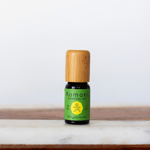 Bergamot pure essential oil in 10 mL bottle with bamboo wood top.