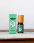 Camphor pure essential oil in 10 mL bottle with bamboo wood top next to box packaging.