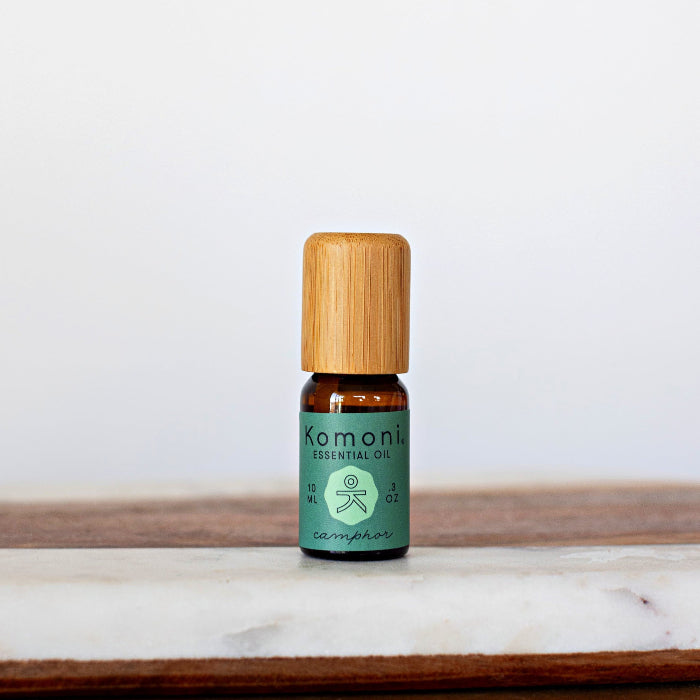 Camphor pure essential oil in 10 mL bottle with bamboo wood top.