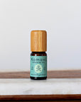 A 10ml vial of Eucalyptus pure essential oil with attractive bamboo wood top.