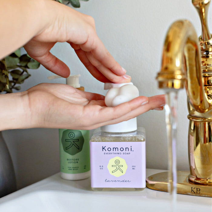 Hands dispense a foam of the Lavender Everything soap for your kitchen or bathroom sink. 