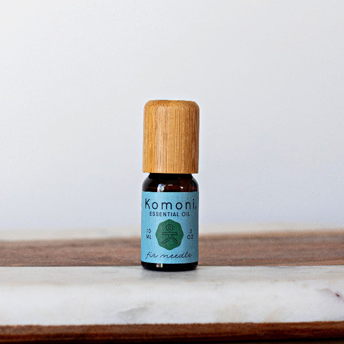 A 10ml vial of Fir Needle pure essential oil with attractive bamboo wood.