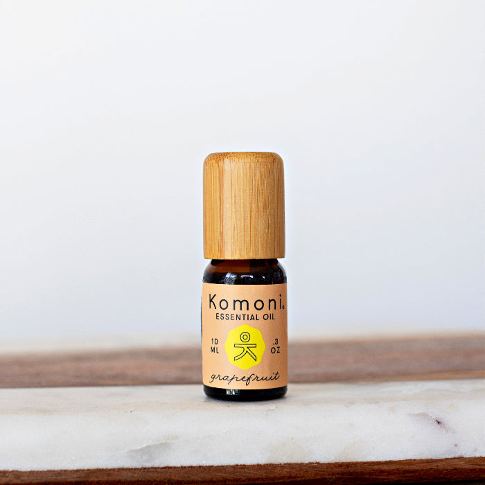 A 10ml vial of Grapefruit pure essential oil with attractive bamboo wood top.