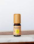 A 10ml vial of Grapefruit pure essential oil with attractive bamboo wood top.