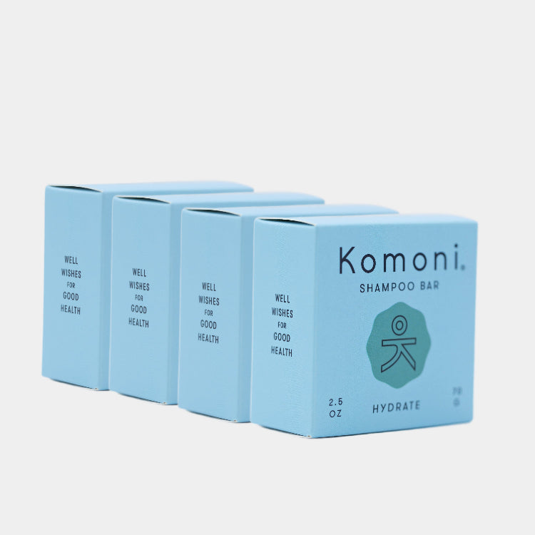 4 pastel blue boxes of HYDRATE concentrated eco-friendly essential oil shampoo bars. 