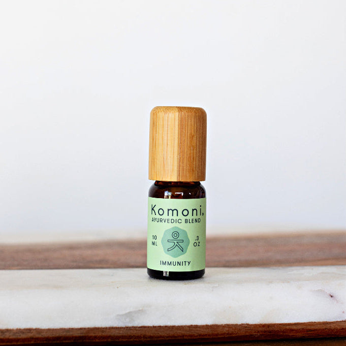 IMMUNITY proprietary blend of pure essential oils in 10 mL bottle with bamboo wood top.