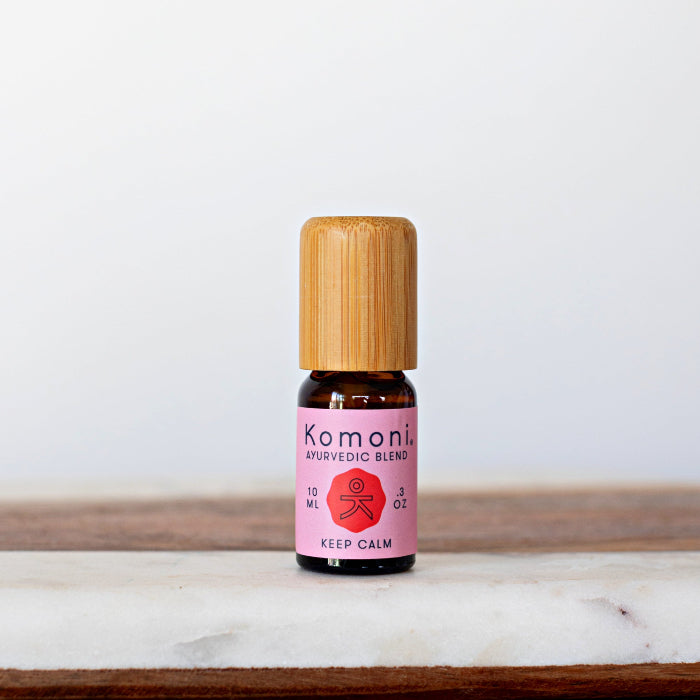 KEEP CALM signature blend of pure essential oils in 10 mL bottle with bamboo wood top.