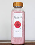 18 oz. bottle of KEEP CALM Bath Soak signature Epsom salt formula with bamboo wood top.