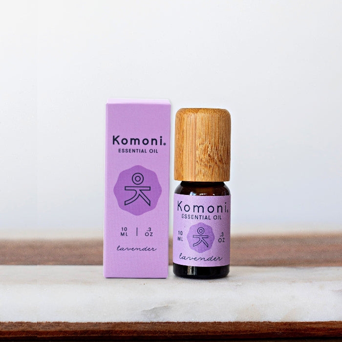 A 10ml vial of Lavender pure essential oil with attractive bamboo wood top beside box packaging.