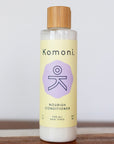 8 oz. pastel yellow bottle of Nourish lavender essential oil conditioner for all hair types.