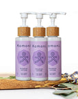 3 Wood top 4 oz. pastel purple pump-bottles of NOURISH pure botanicals & essential oils body lotion.