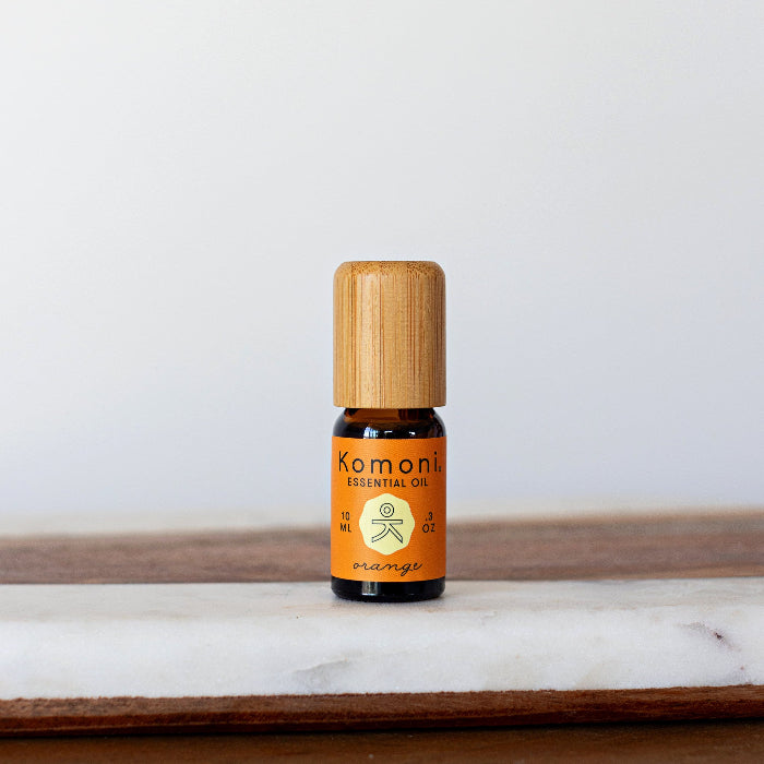 A 10ml vial of Orange pure essential oil with attractive bamboo wood top.