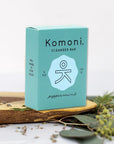 Peppermint essential oil face & body cleanser bar shown in sea-foam blue box packaging.