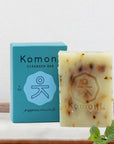 Peppermint essential oil face & body cleanser bar shown in front of sea-foam blue box packaging.