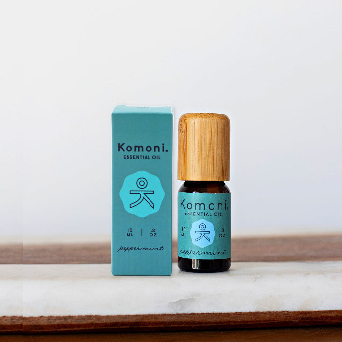 A 10 mL vial of Peppermint Essential Oil with attractive bamboo wood top next to box packaging.