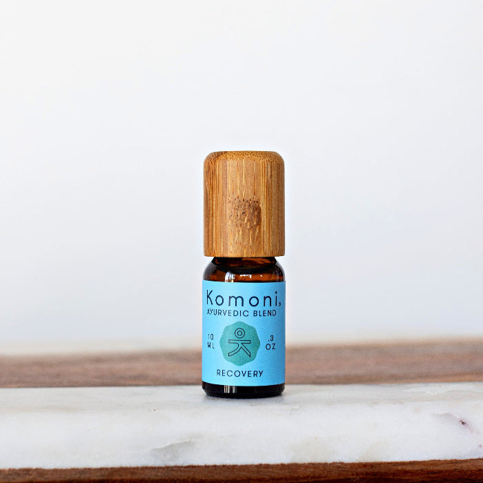 RECOVERY signature ayurvedic blend of pure essential oils in 10 mL bottle with bamboo wood.