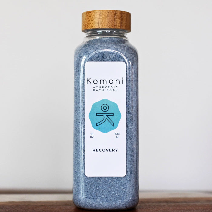 18 oz. bottle of RECOVERY Bath Soak signature Epsom salt formula with bamboo wood top.