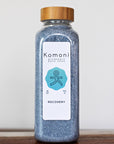 18 oz. bottle of RECOVERY Bath Soak signature Epsom salt formula with bamboo wood top.