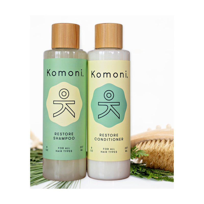 Restore shampoo and conditioner in 8 oz. bottles with bamboo wood tops.