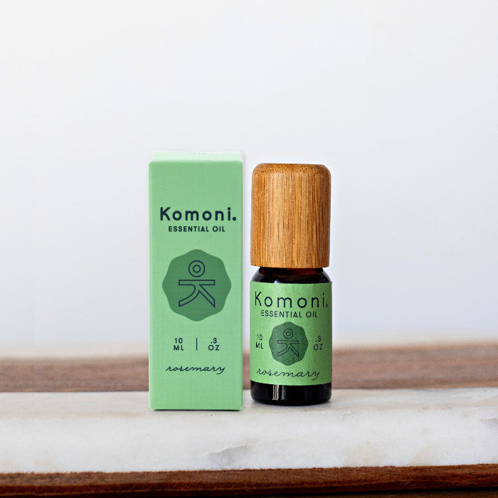 Rosemary pure essential oil in 10 mL bottle with bamboo wood top next to box packaging.