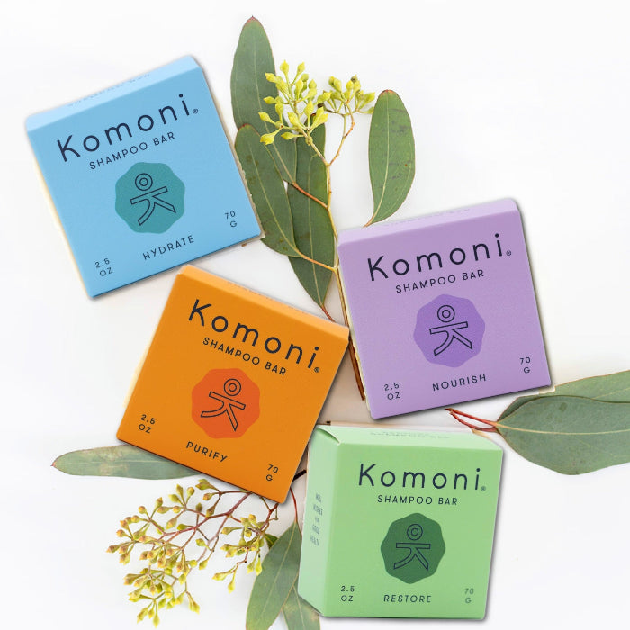 Small batch Hydrate, Nourish, Purify, and Restore shampoo bars shown in colorful box packaging.