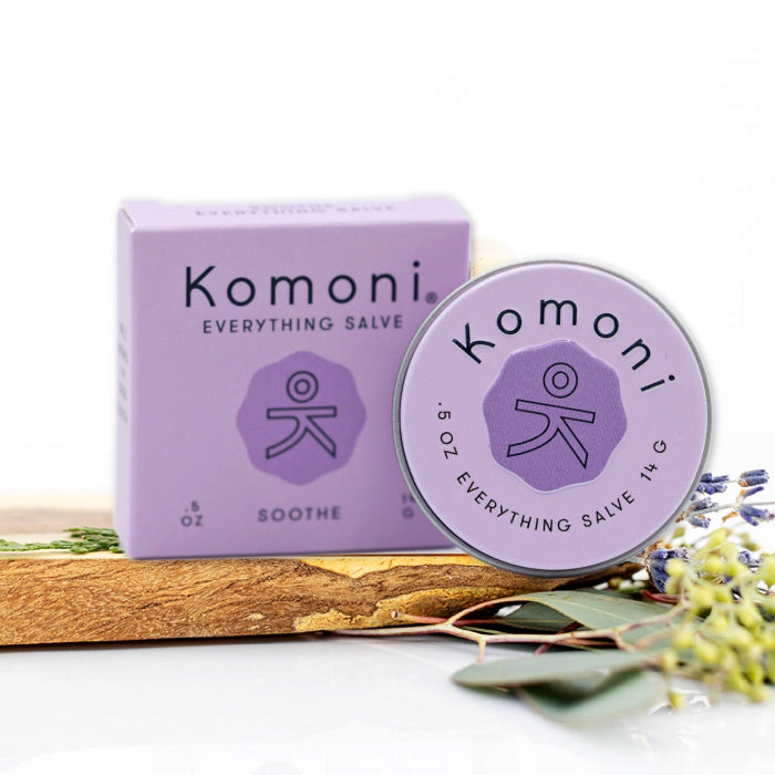 Lavender essential oil Soothe everything lips, hands, skin salve shown in tin in front of box. 