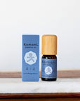 Wintergreen pure essential oil in 10 mL bottle with bamboo wood top next to box packaging.